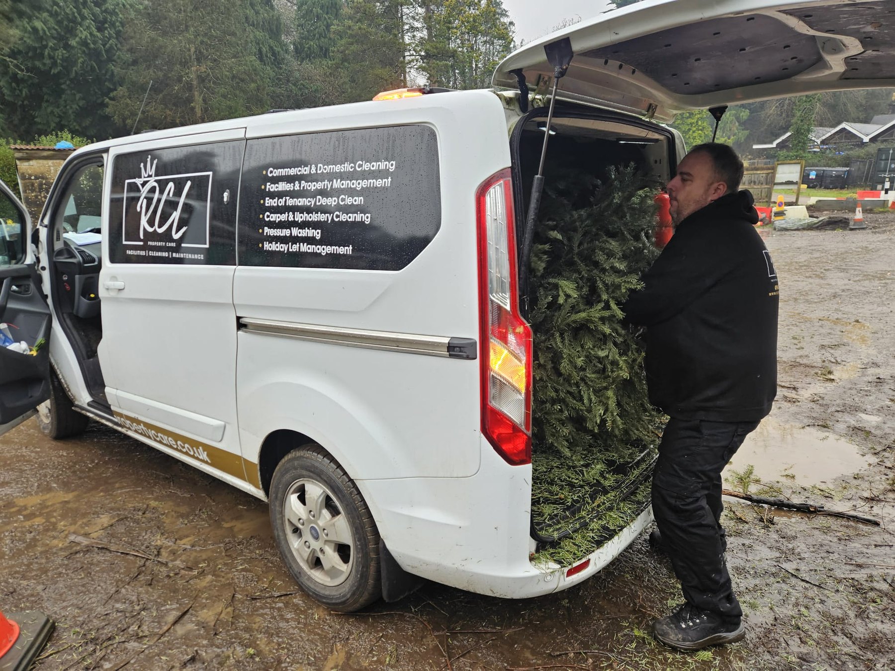 RCL Property Care team member loading a company van during a collection